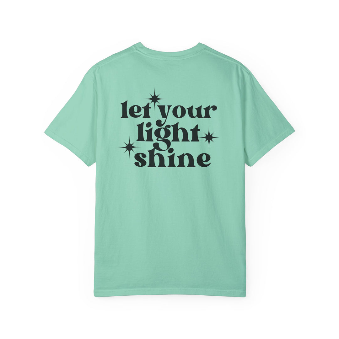 Let Your Light Shine Tee: Back view of a light blue shirt with a black star logo. 100% ring-spun cotton, garment-dyed for coziness, relaxed fit, durable double-needle stitching, and tubular shape. From Worlds Worst Tees.