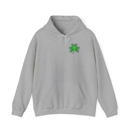A grey Lucky Lucky Lucky hoodie with a green clover, featuring a kangaroo pocket and matching drawstring. Unisex, cozy blend of cotton and polyester, perfect for cold days. Medium-heavy fabric, tear-away label, true to size.