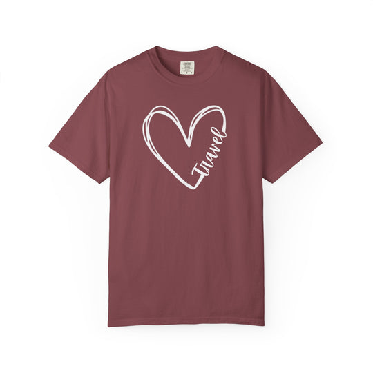 Maroon crew-neck tee with a white heart line-drawing featuring Travel in script, offering a relaxed fit and durable, garment-dyed cotton comfort.