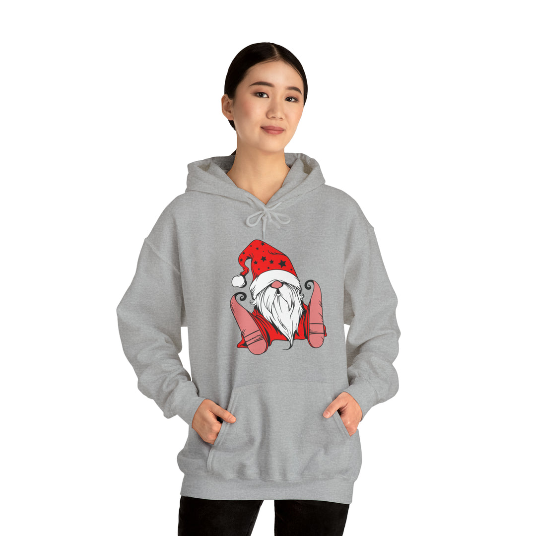 A Christmas Gnome Hoodie, a cozy unisex blend of cotton and polyester. Features a gnome design on a grey sweatshirt with a kangaroo pocket and drawstring hood. Ideal for warmth and comfort.