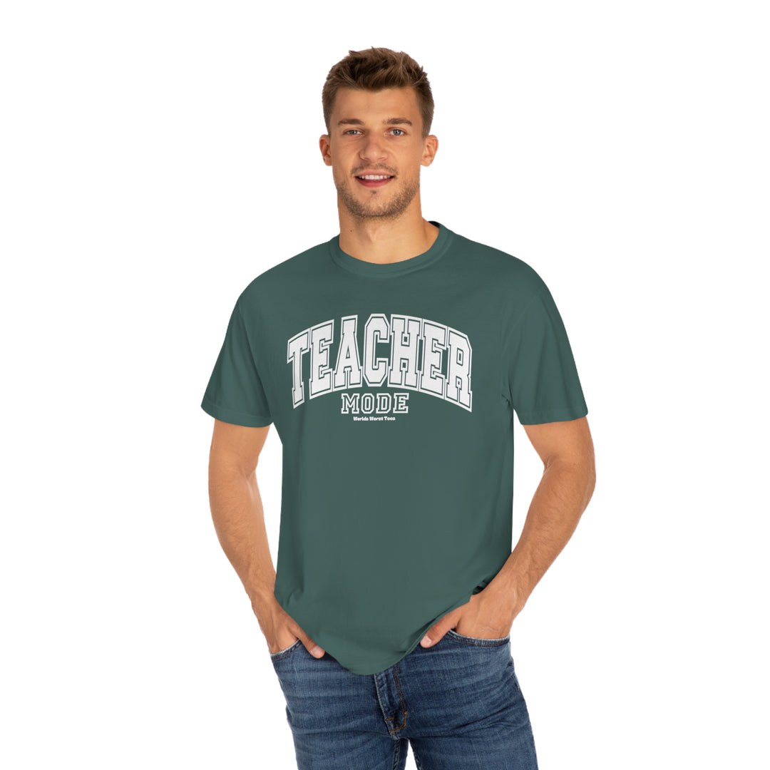 A relaxed fit Teacher Mode Tee sweatshirt in green, featuring a man in a green shirt. Made of 80% ring-spun cotton and 20% polyester, with rolled-forward shoulders and a back neck patch.