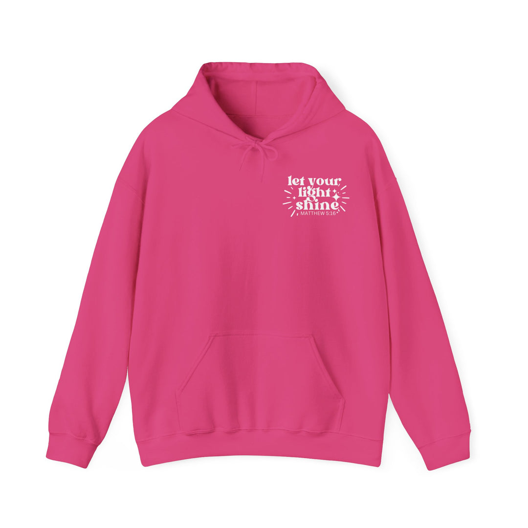 Unisex Let Your Light Shine Hoodie, pink sweatshirt with white text. Heavy cotton-polyester blend, kangaroo pocket, drawstring hood. Cozy, stylish outerwear from Worlds Worst Tees.