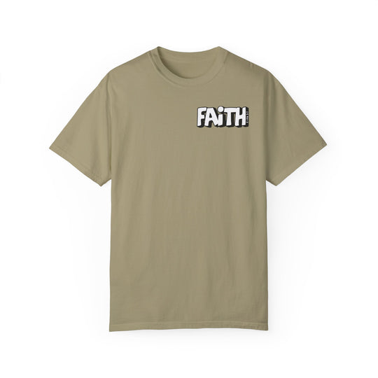 A tan Walk By Faith Not By Sight Tee, featuring white text and logo. 100% ring-spun cotton, garment-dyed for coziness. Relaxed fit, double-needle stitching for durability, no side-seams for shape retention.