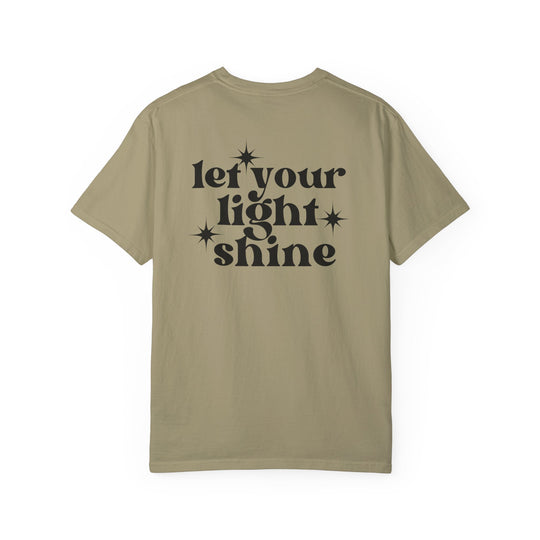 Let Your Light Shine Tee: Back view of tan shirt with black text. 100% ring-spun cotton, garment-dyed for coziness. Relaxed fit, double-needle stitching, no side-seams for durability and shape retention. Worlds Worst Tees.