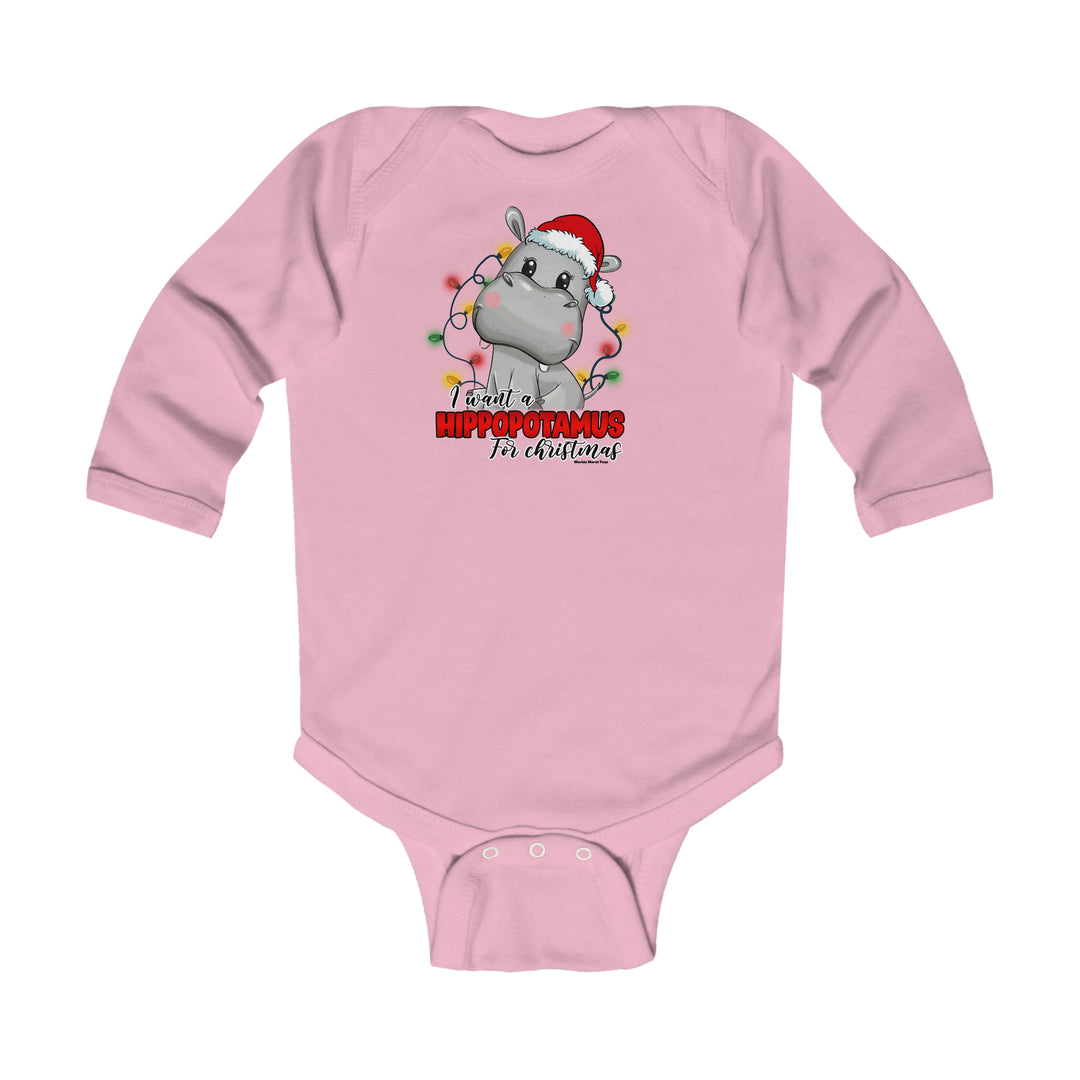 Infant long sleeve bodysuit featuring a cartoon hippo in a Santa hat. Soft 100% cotton fabric with plastic snaps for easy changing. From 'Worlds Worst Tees'.