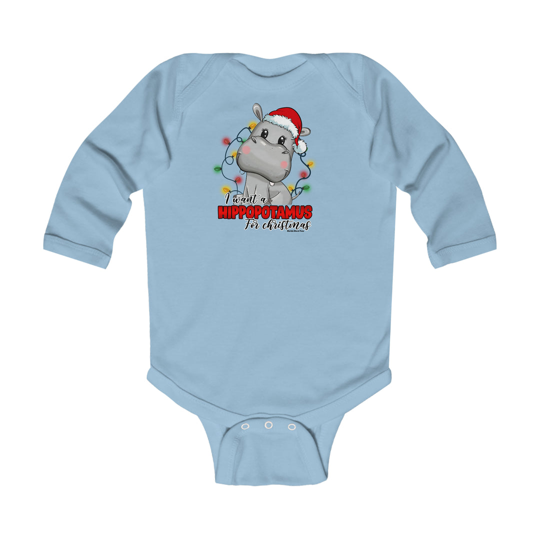 A baby bodysuit featuring a cartoon hippo wearing a Santa hat. Made of soft cotton for baby's comfort, with plastic snaps for easy changing. From Worlds Worst Tees.