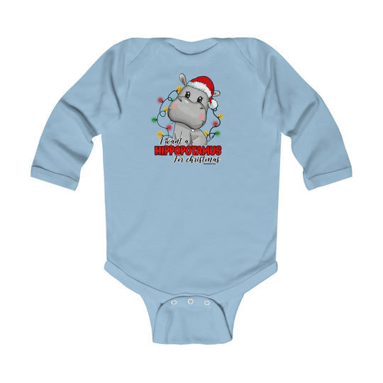 A baby bodysuit featuring a cartoon hippo wearing a Santa hat. Made of soft cotton for baby's comfort, with plastic snaps for easy changing. From Worlds Worst Tees.