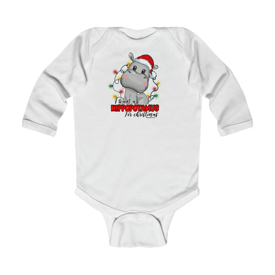 A white baby bodysuit featuring a cartoon hippo wearing a Santa hat. Infant long sleeve bodysuit for durability and comfort. Plastic snaps for easy changing. 100% cotton. From 'Worlds Worst Tees'.