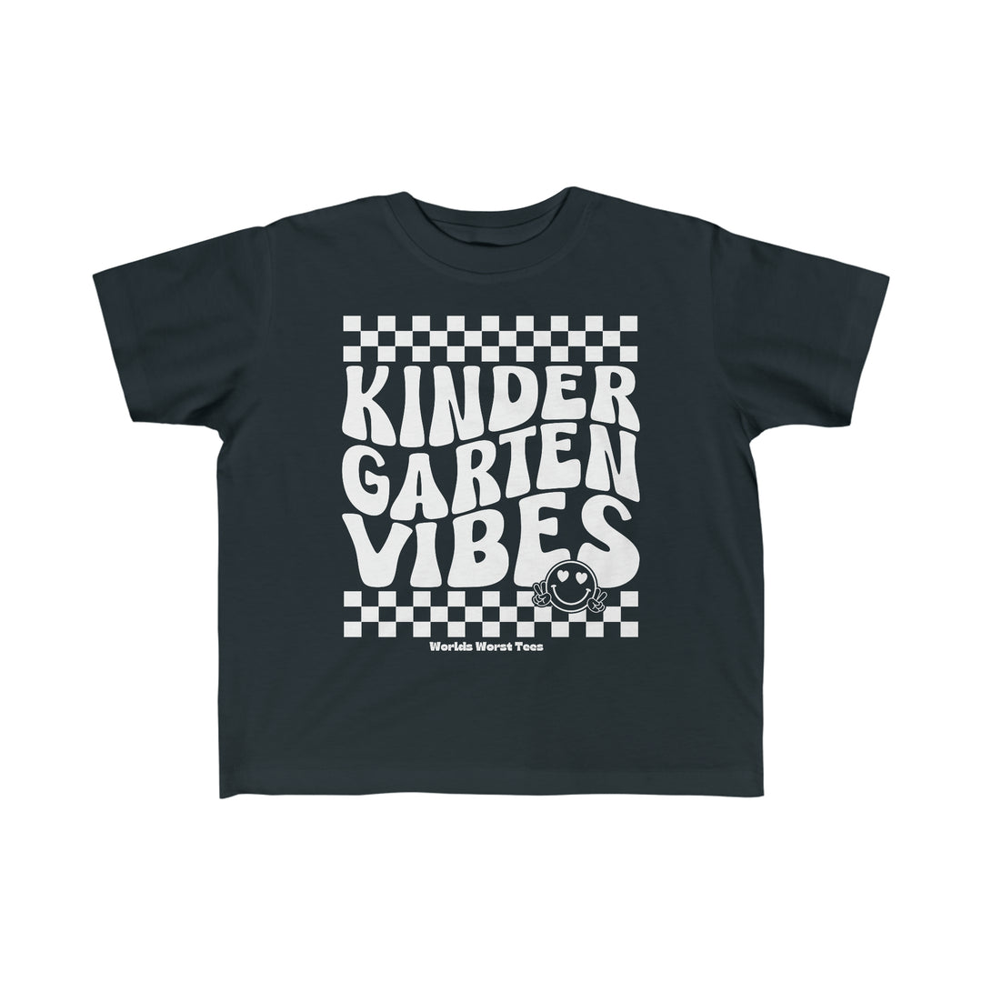 A Kindergarten Vibes Toddler Tee featuring black and white designs, perfect for sensitive skin. Made of 100% combed ringspun cotton, light fabric, classic fit, tear-away label, and true-to-size.