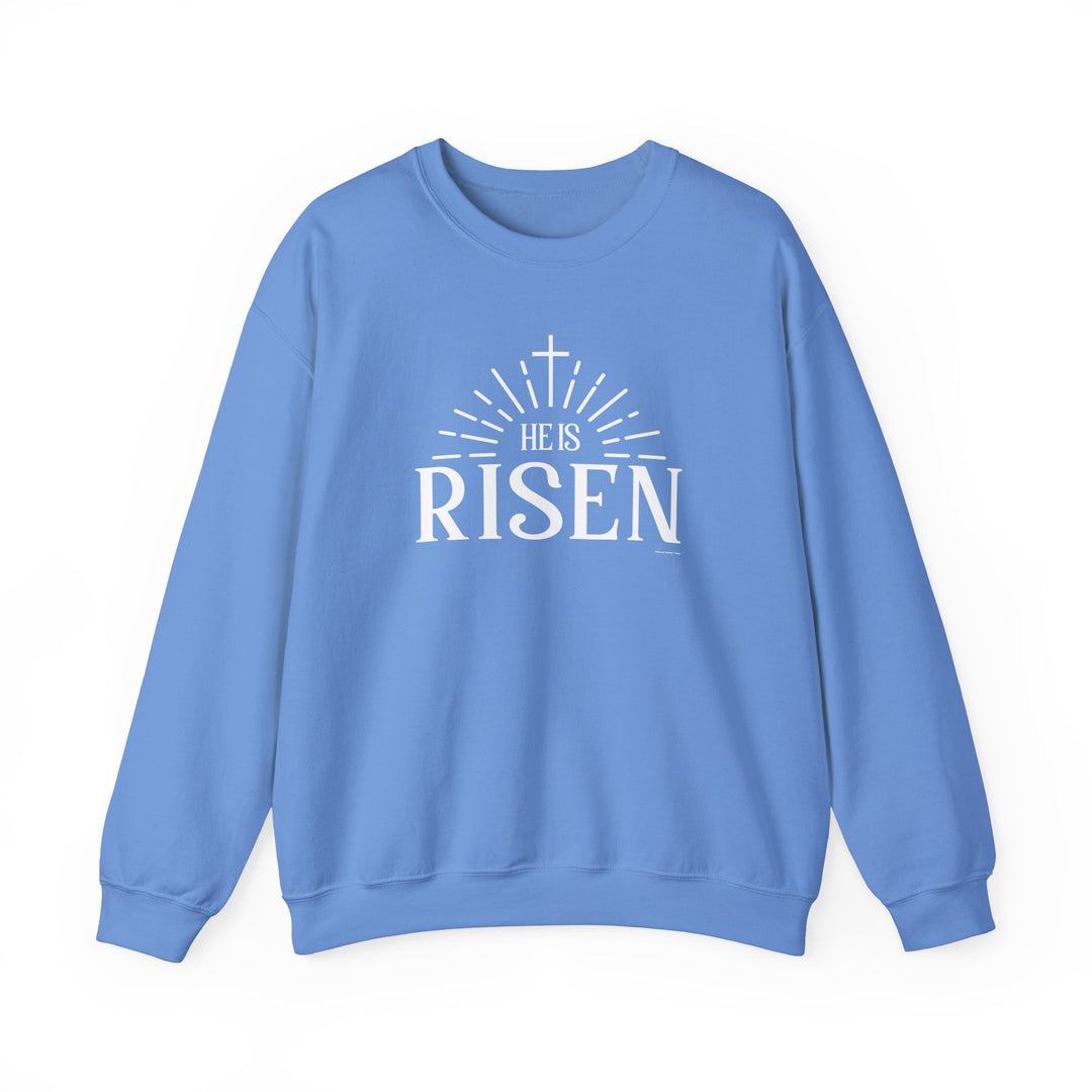 A unisex He is Risen Crew sweatshirt in heavy blend fabric, featuring ribbed knit collar, double-needle stitching, and tear-away label for itch-free comfort. Ideal for colder months, made with 50% cotton and 50% polyester.