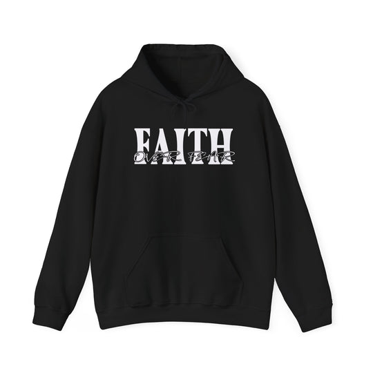 A black unisex Faith Over Fear Hoodie with white text, featuring a kangaroo pocket and matching drawstring. Made of 50% cotton and 50% polyester, offering warmth and comfort. Classic fit, tear-away label, and medium-heavy fabric.