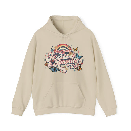 A white hoodie with a graphic design featuring butterflies and flowers. Unisex heavy blend for comfort, cotton-polyester mix, kangaroo pocket, and drawstring hood. She Loves Jesus and America Hoodie.