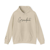 A cozy Grandma Love Hoodie, white with black text, in a classic fit. Unisex heavy blend with kangaroo pocket and matching drawstring, perfect for chilly days. Cotton-polyester mix, medium-heavy fabric.
