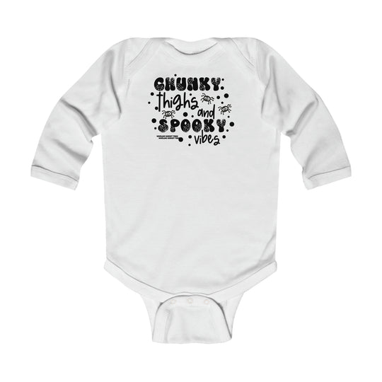Baby bodysuit with black text, Chunky Thighs and Spooky Vibes design. Combed ring-spun cotton, plastic snaps for easy changing, ribbed bindings for durability. Long sleeves, sizes NB to 18M. Classic fit.