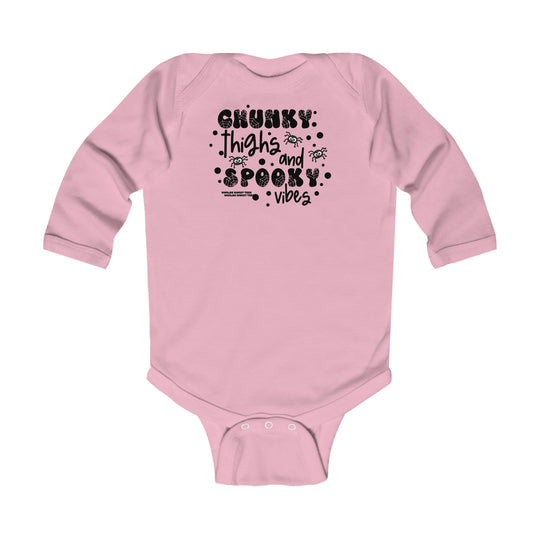 Chunky Thighs and Spooky Vibes Long Sleeved Onesie for infants in light fabric with ribbed bindings for durability. Plastic snaps for easy changing. 100% combed ring-spun cotton. Sizes: NB, 6M, 12M, 18M.
