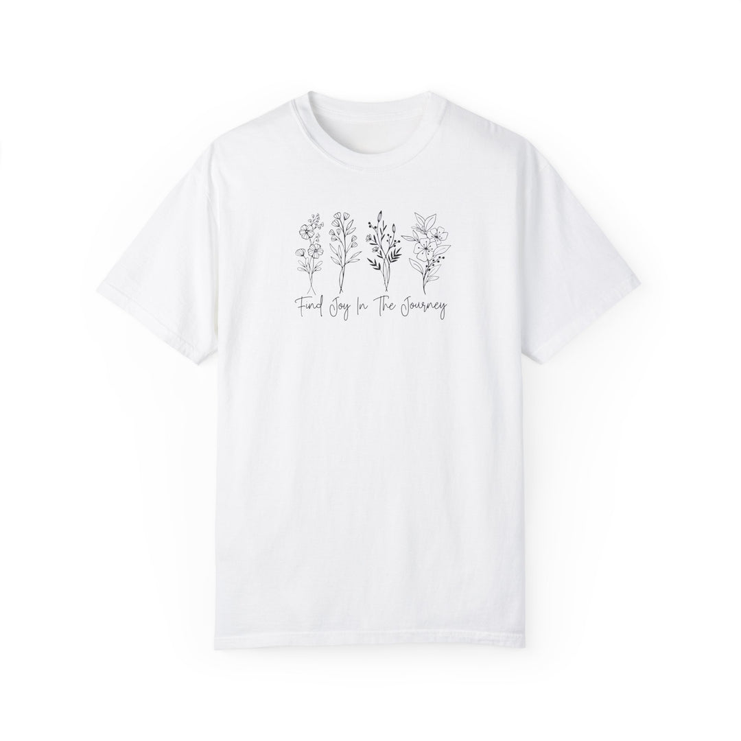 A white tee featuring trees and flowers, embodying the Find Joy in the Journey Tee. Crafted from 100% ring-spun cotton, with a relaxed fit and durable double-needle stitching. Ideal for daily wear.