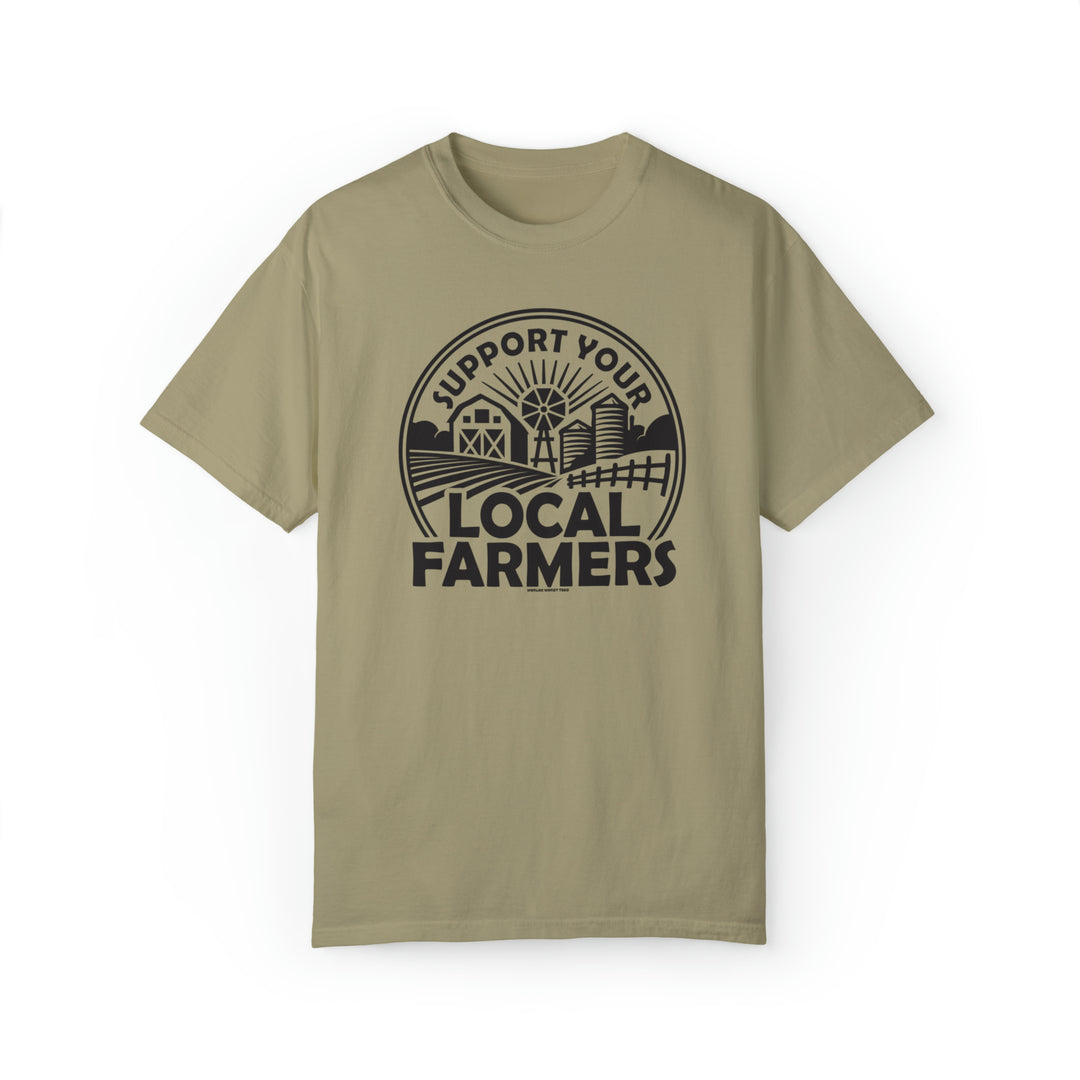 Unisex Support Your Local Farmer Tee, a garment-dyed t-shirt with a graphic design logo. Made of 80% ring-spun cotton and 20% polyester, featuring a relaxed fit and rolled-forward shoulder. Dimensions: S - 18.25W x 26.62L, M - 20.25W x 28.00L, L - 22.00W x 29.37L, XL - 24.00W x 30.75L, 2XL - 26.00W x 31.62L, 3XL - 27.75W x 32.50L, 4XL - 29.75W x 33.50L.