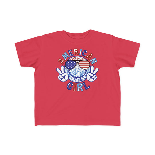 American Girl Toddler Tee featuring a red shirt with a cartoon character. Soft 100% combed ringspun cotton, light fabric, classic fit, perfect for sensitive skin. Sizes: 2T, 3T, 4T, 5-6T.