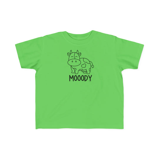 Moody Toddler Tee: A green shirt featuring a cow, perfect for sensitive toddler skin. Made of 100% combed ringspun cotton, light fabric, classic fit, and tear-away label. Ideal for first adventures.