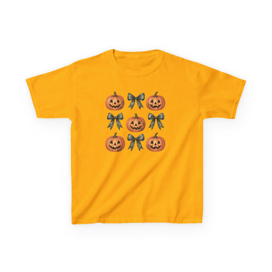 Jack and Bow Kids Tee: Bright yellow T-shirt featuring a 3x3 grid of alternating Halloween jack-o’-lanterns and dark-gray ribbon bows, perfect for everyday wear.