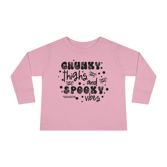Chunky Thighs and Spooky Vibes Toddler Long Sleeve Tee, featuring black text on a pink shirt. Made of 100% combed ringspun cotton, with topstitched ribbed collar for durability and EasyTear™ label for sensitive skin.