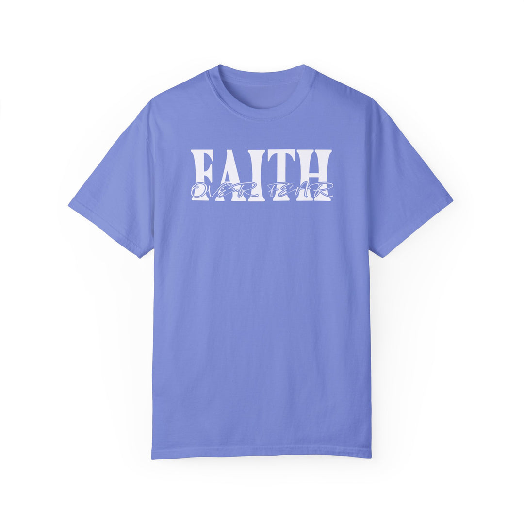 A Faith Over Fear Tee, a blue t-shirt with white text, made of 100% ring-spun cotton. Medium weight, relaxed fit, double-needle stitching for durability, and seamless design for comfort.