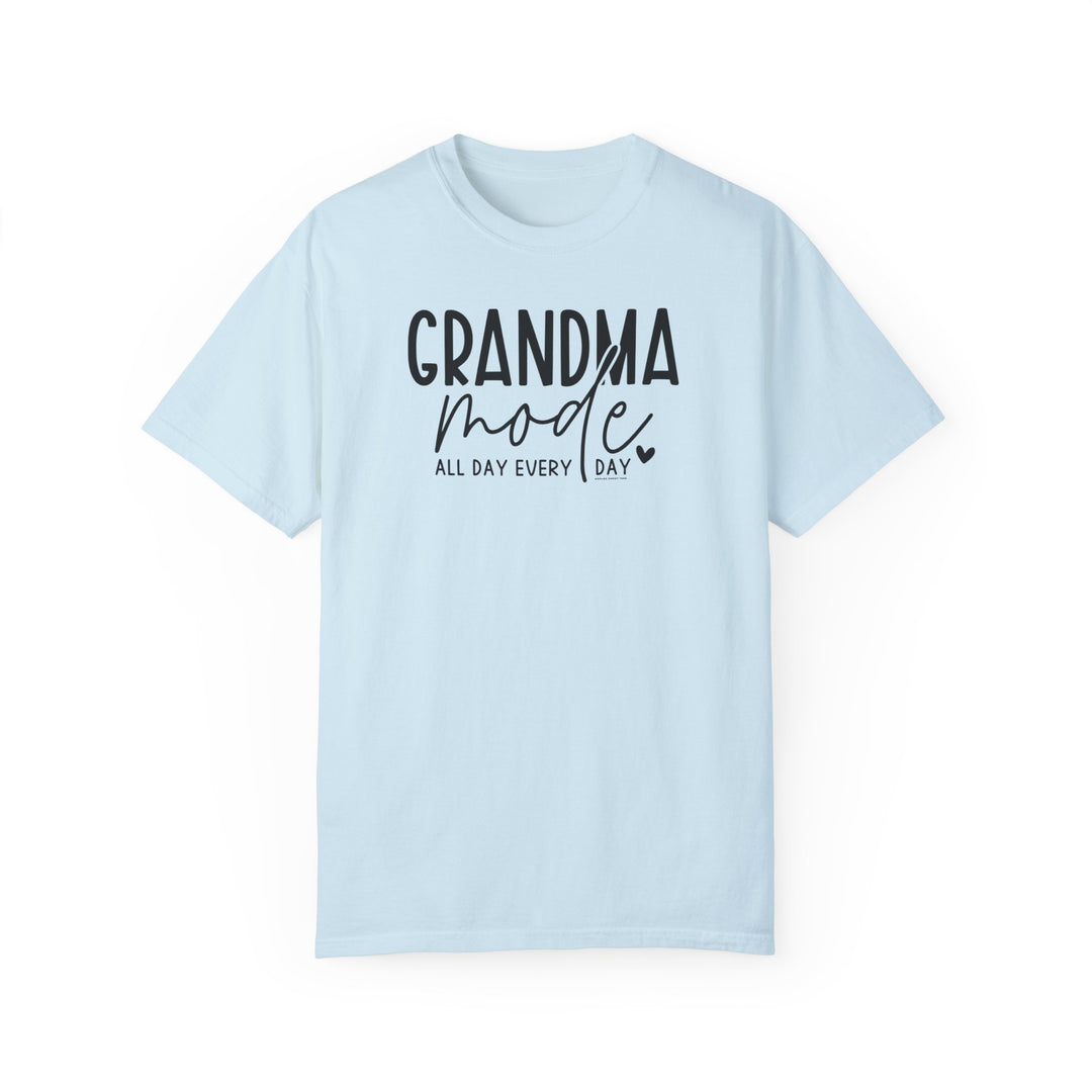 Grandma Mode Tee: A light blue garment-dyed t-shirt with black text. 100% ring-spun cotton, medium weight, relaxed fit, durable double-needle stitching, and seamless design for ultimate comfort and style.