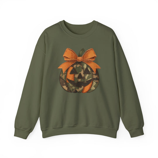 Olive-green Jackie O Crew sweatshirt featuring a camo-patterned jack-o'-lantern with an orange bow, blending comfort and a playful Halloween style.