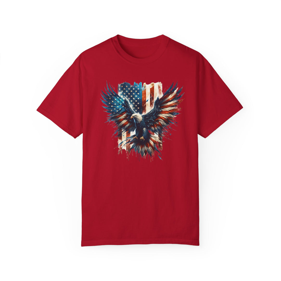 American Eagle Tee: Red shirt featuring an eagle and flag design. 100% ring-spun cotton, garment-dyed for coziness. Medium weight, relaxed fit, durable double-needle stitching. No side-seams for a tubular shape.