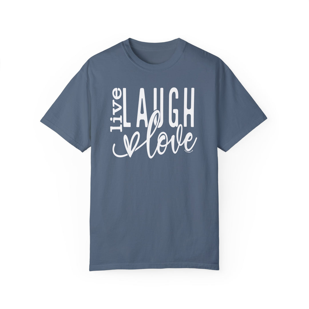 A relaxed fit Live Laugh Love Tee in blue with white text, crafted from 100% ring-spun cotton. Garment-dyed for coziness, featuring double-needle stitching for durability and a seamless design for a tubular shape.