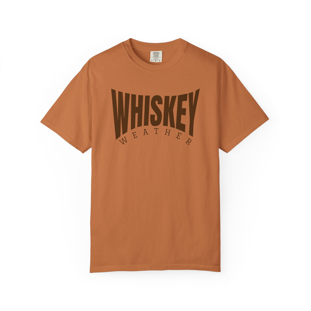 Whiskey Weather Tee: Burnt-orange Comfort Colors T-shirt with WHISKEY WEATHER graphic, offering a relaxed fit and durable, soft-washed cotton for daily comfort.