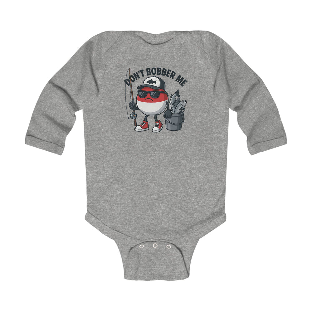 Don't Bobber Me Long Sleeve Onesie featuring a cartoon fishing bobber character with cap and sunglasses, holding a rod and fish bucket, perfect for playful infant style.