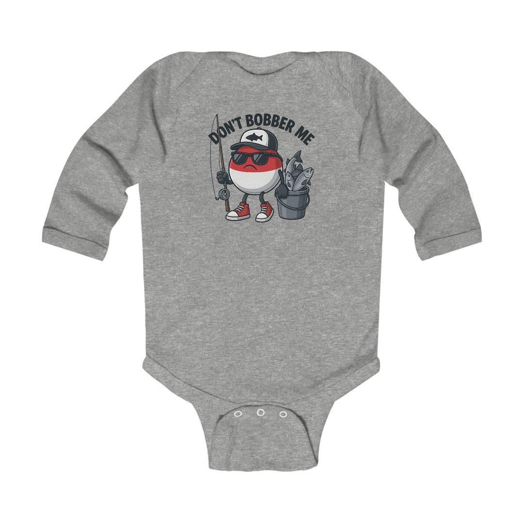 Don't Bobber Me Long Sleeve Onesie featuring a cartoon fishing bobber character with cap and sunglasses, holding a rod and fish bucket, perfect for playful infant style.