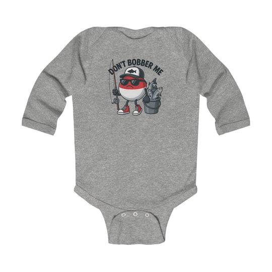 Don't Bobber Me Long Sleeve Onesie featuring a cartoon fishing bobber character with cap and sunglasses, holding a rod and fish bucket, perfect for playful infant style.