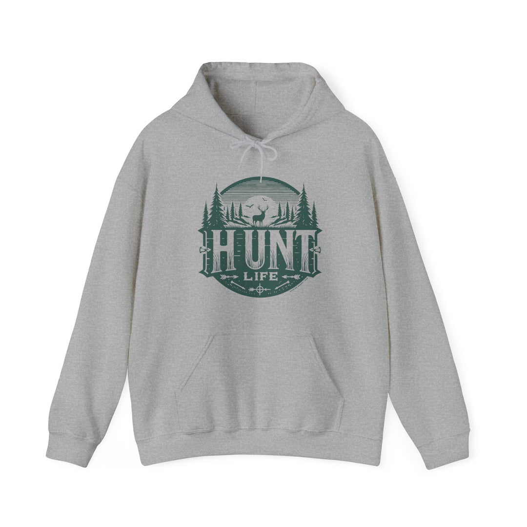 A grey Hunt Life Hoodie sweatshirt with a logo, featuring a deer and birds silhouette. Unisex heavy blend fabric for warmth and comfort, with kangaroo pocket and drawstring hood. Ideal for relaxation and printing.