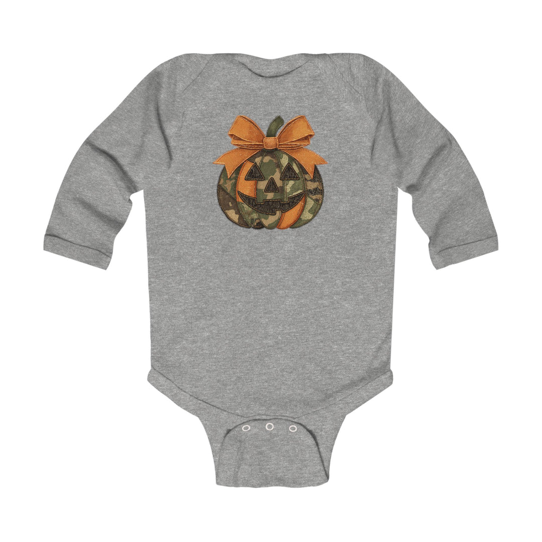Jackie O Long Sleeve Onesie featuring a heather-gray design with a camo and orange jack-o’-lantern graphic, complete with snap closures for easy changing.