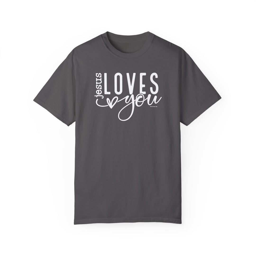 A grey Jesus Loves You Tee, featuring white text. 100% ring-spun cotton, soft-washed, garment-dyed fabric for coziness. Relaxed fit, double-needle stitching for durability, seamless design. From Worlds Worst Tees.