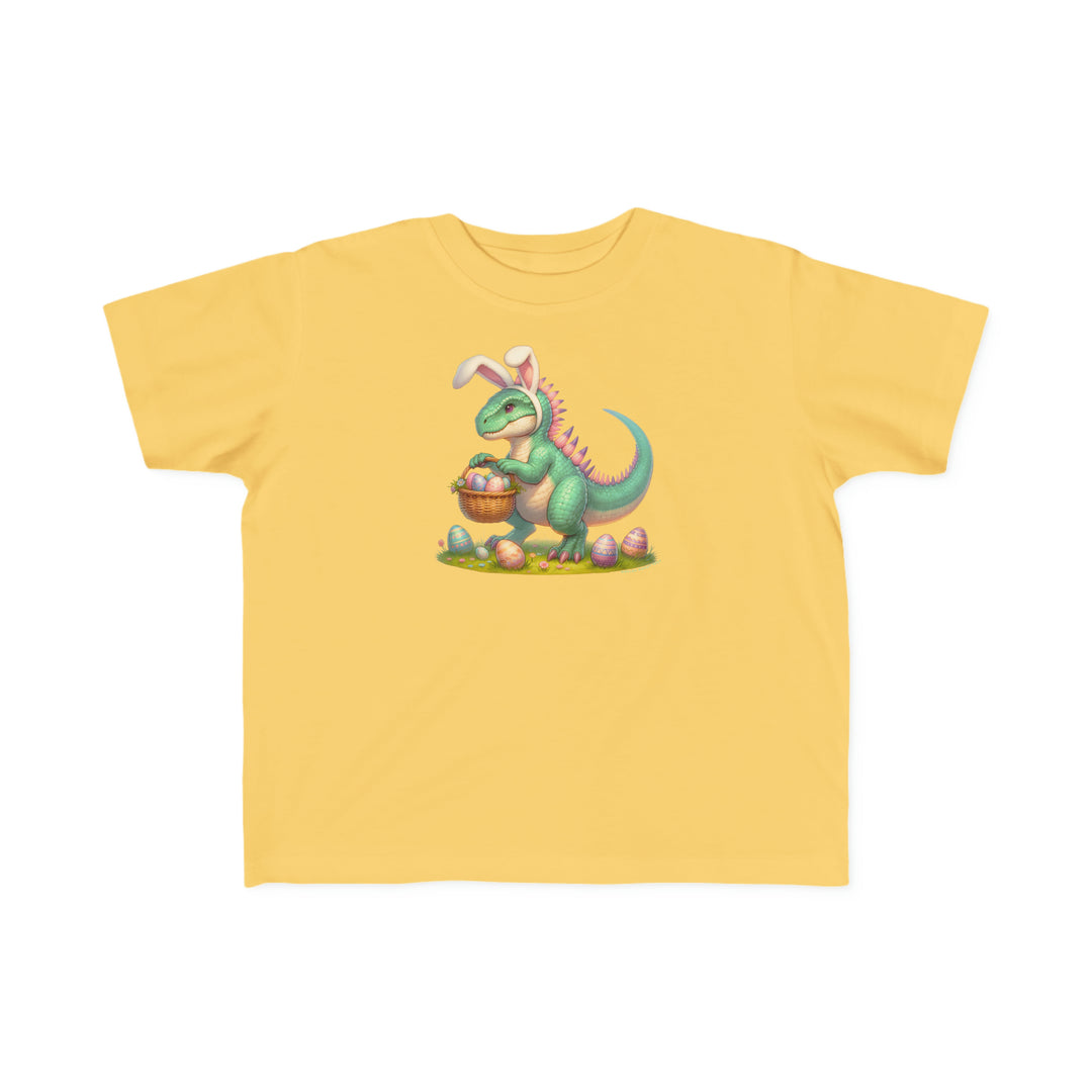 Eggosaurus Toddler Tee: A yellow t-shirt featuring a cartoon dinosaur holding a basket of eggs. Soft, durable fabric perfect for sensitive skin, ideal for little adventurers.