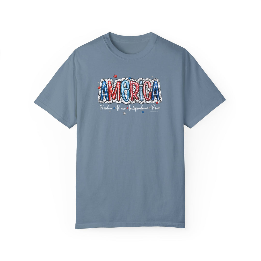 America Tee: Garment-dyed t-shirt in ring-spun cotton, featuring a relaxed fit for daily comfort. Double-needle stitching for durability, no side-seams for shape retention. From 'Worlds Worst Tees'.