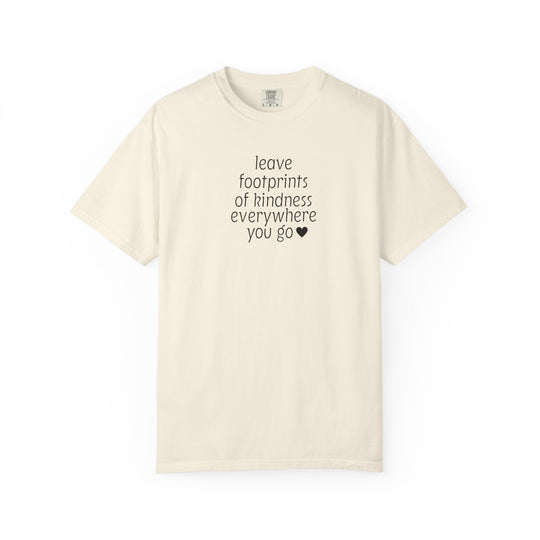 Cream-colored Leave Kindness Tee with black lettering, promoting kindness. Features short sleeves and a relaxed fit, made from 100% ring-spun cotton for comfort.