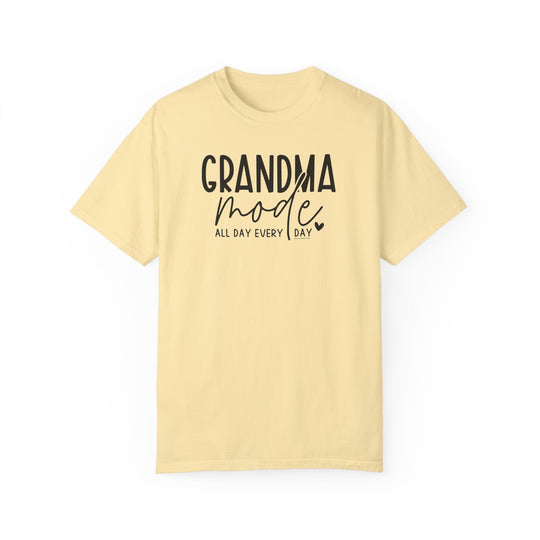 A Grandma Mode Tee, a yellow t-shirt with black text, made of 100% ring-spun cotton. Features a relaxed fit, double-needle stitching, and no side-seams for durability and comfort.