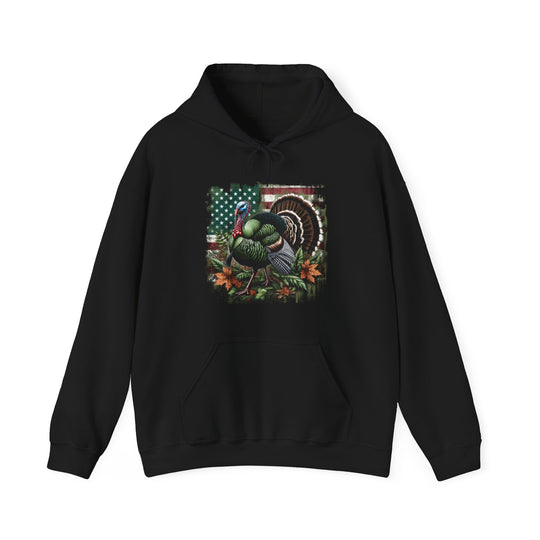 A black Turkey Hunting Hoodie, a blend of cotton and polyester, with a kangaroo pocket and drawstring hood. Medium-heavy fabric for warmth and comfort. Unisex sizing, tear-away label.