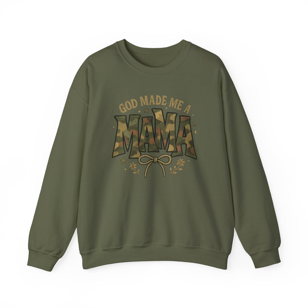 Army-green crewneck sweatshirt with “GOD MADE ME A MAMA” text, featuring camouflage MAMA and bow graphic with stars and floral sprigs.