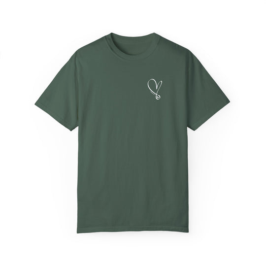 A green t-shirt featuring a heart design and needle detail, the I am Beautiful Tee by Worlds Worst Tees. Made of 100% ring-spun cotton, garment-dyed for coziness, with a relaxed fit and durable double-needle stitching.