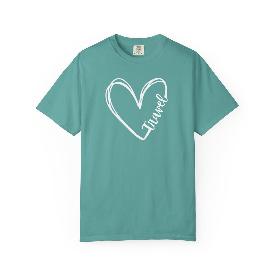 Teal Travel Tee with white heart outline and cursive Travel, featuring short sleeves and a relaxed fit made from soft, ring-spun cotton.