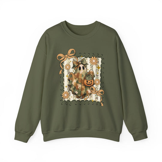 Olive-green crewneck sweatshirt featuring a quilted ghost graphic with camo fabric, jack-o’-lantern, and autumnal details, embodying cozy and durable design.