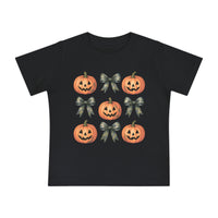Pumpkins and Bows Baby Tee featuring a 3x3 pattern of jack-o’-lanterns and camo-style bows on a black T-shirt, offering style and comfort for little ones.