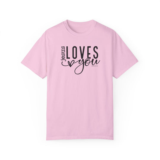 Relaxed fit Jesus Loves You Tee in pink with black text. 100% ring-spun cotton, garment-dyed for coziness. Durable double-needle stitching, no side-seams for shape retention. Ideal for daily wear.