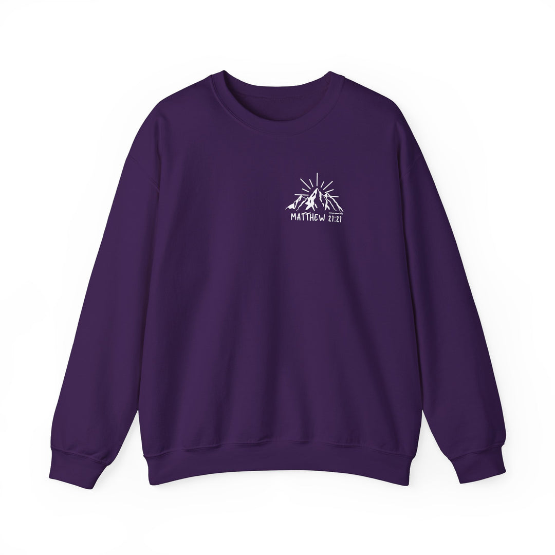 A cozy unisex heavy blend crewneck sweatshirt featuring a mountain and sun design. Made from 50% cotton and 50% polyester for comfort and durability. Ideal for colder months. From Worlds Worst Tees.
