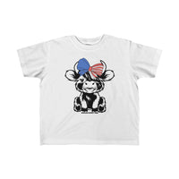 Toddler tee with a cartoon cow and bow design, ideal for sensitive skin. Made of 100% combed ringspun cotton, light fabric, tear-away label, and a classic fit. Perfect for little adventurers.